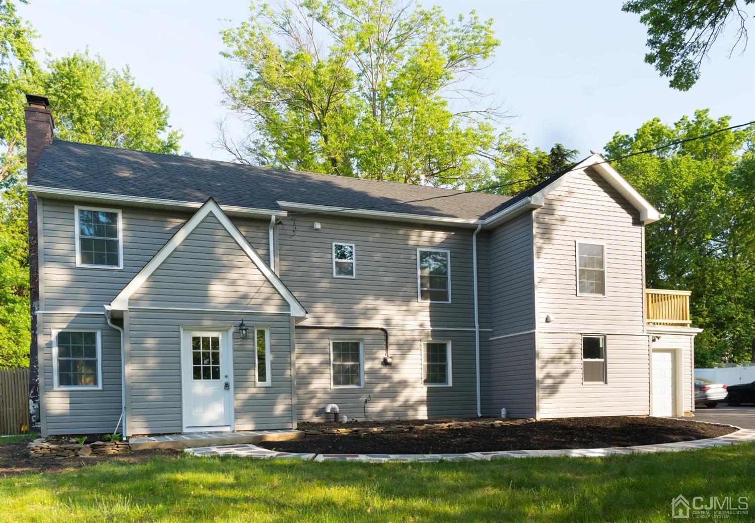 429 Chain O' Hills Road Colonia, NJ 07067 - Photo 5 of 44 a front view of house with yard and green space