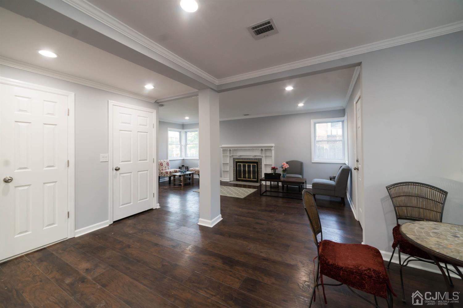 429 Chain O' Hills Road Colonia, NJ 07067 - Photo 42 of 44 a living room with furniture and a fireplace