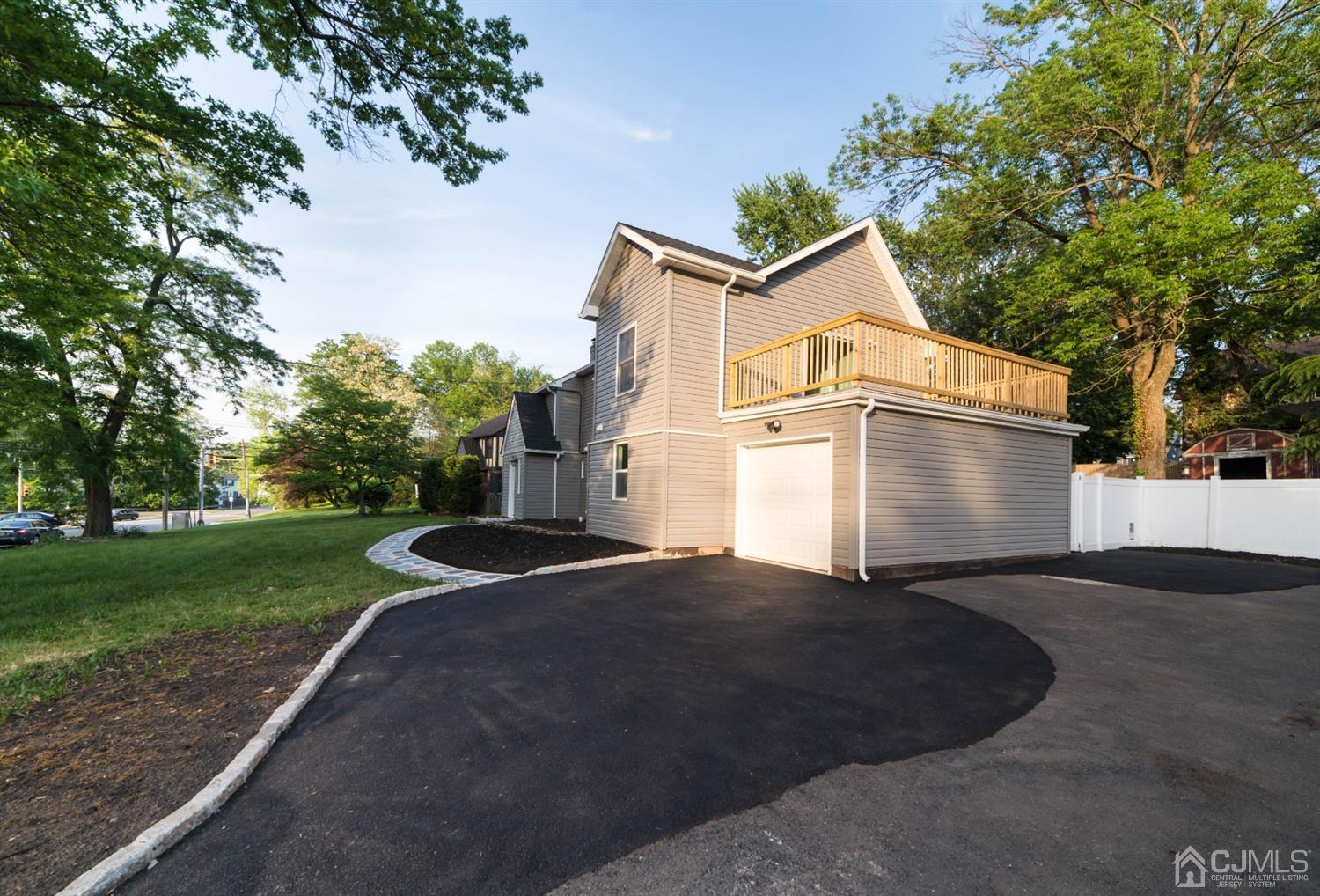 429 Chain O' Hills Road Colonia, NJ 07067 - Photo 44 of 44 a front view of a house with a yard