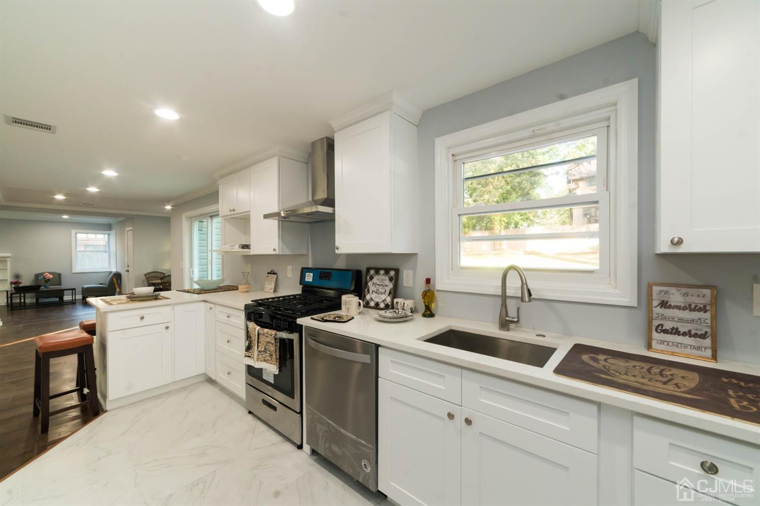 429 Chain O' Hills Road Colonia, NJ 07067 - Photo 7 of 44 a kitchen with a sink stove top oven and refrigerator