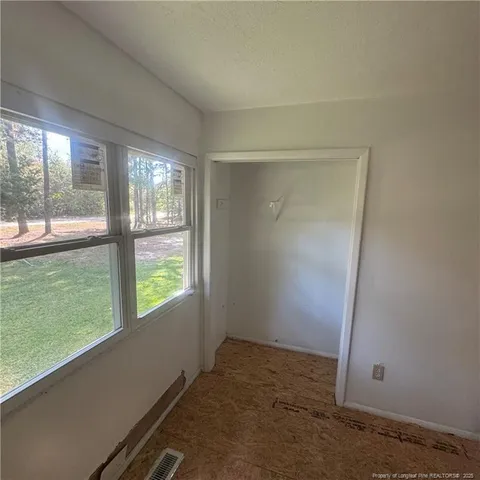 an empty room with windows