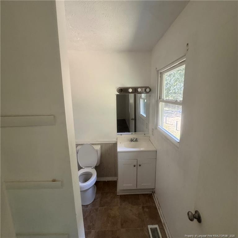 415 Brockington Road Fairmont, NC 28340 - Photo 15 of 22 a bathroom with a toilet sink and mirror