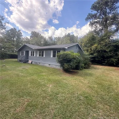 a backyard of a house with lots of green space