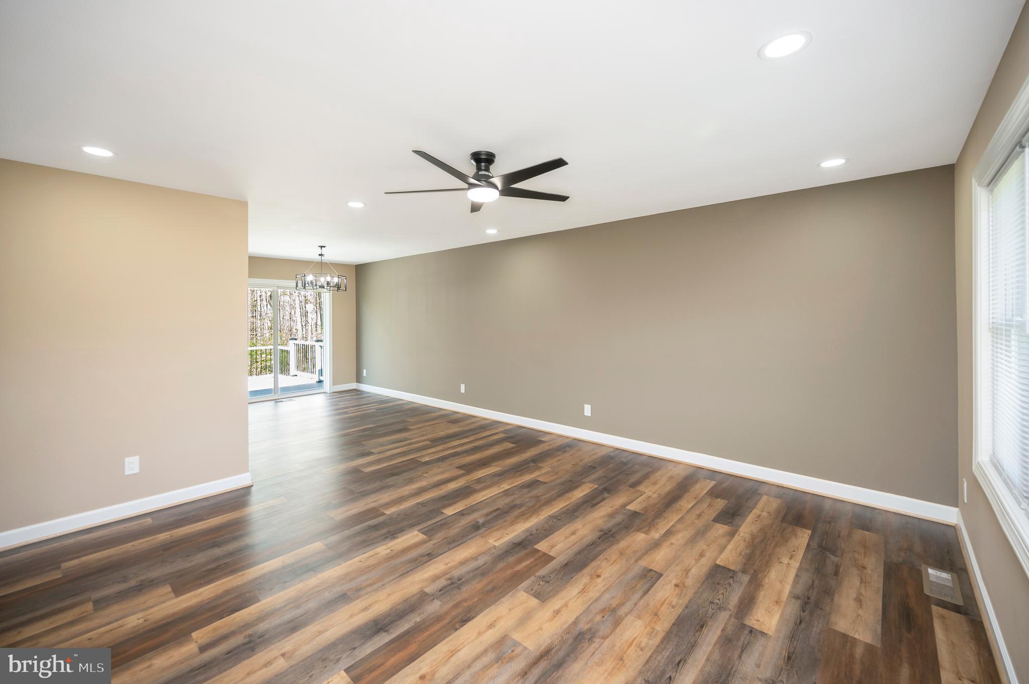 13452 Post Oak Road Spotsylvania, VA 22551 - Photo 20 of 56 an empty room with wooden floor and a ceiling fan