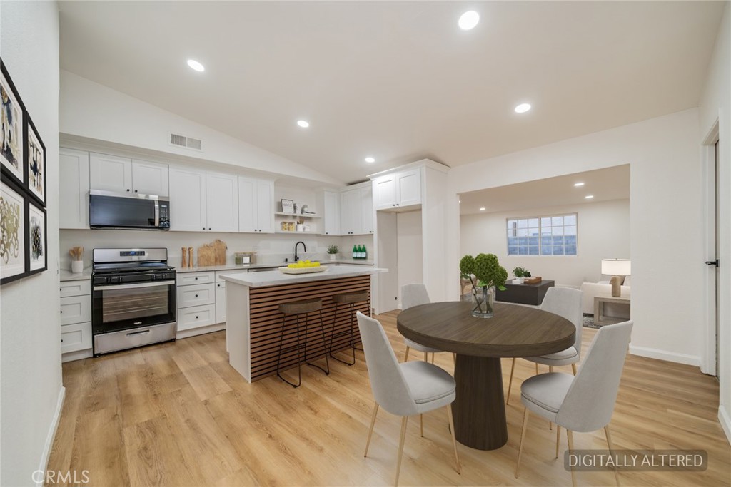 555 North Chestnut Avenue Rialto, CA 92376 - Photo 3 of 33 a kitchen with a sink cabinets and wooden floor
