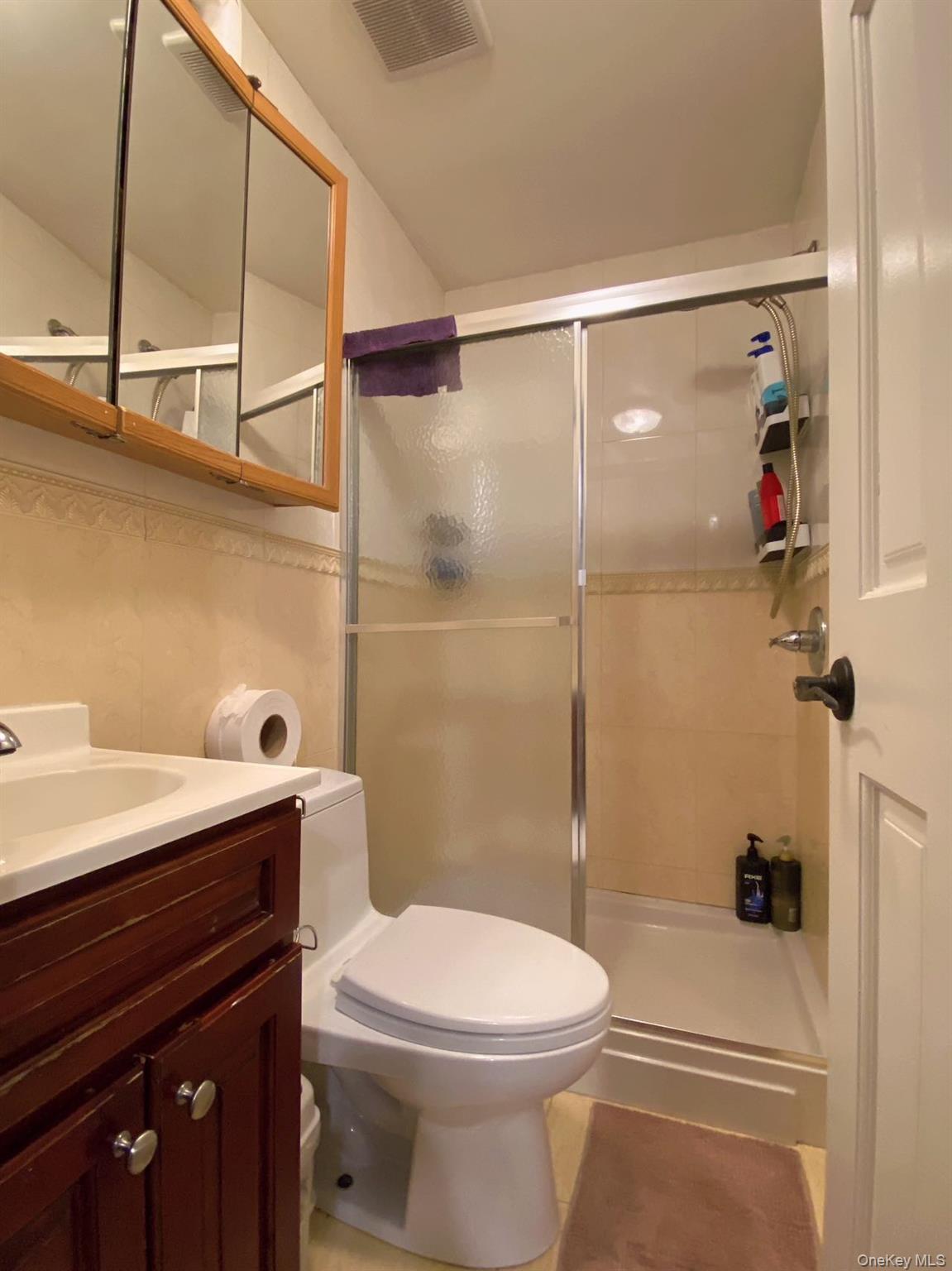 90-19 Corona Avenue Queens, NY 11373 - Photo 10 of 23 a bathroom with a sink a toilet and shower