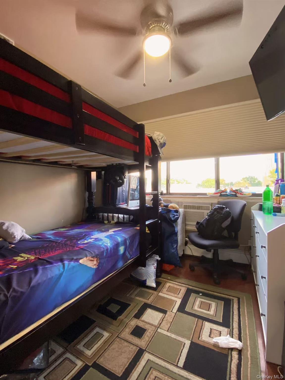 90-19 Corona Avenue Queens, NY 11373 - Photo 12 of 23 a room with furniture and a flat screen tv