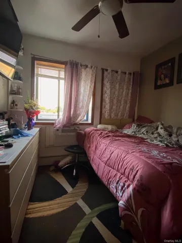 a room with furniture and a flat screen tv