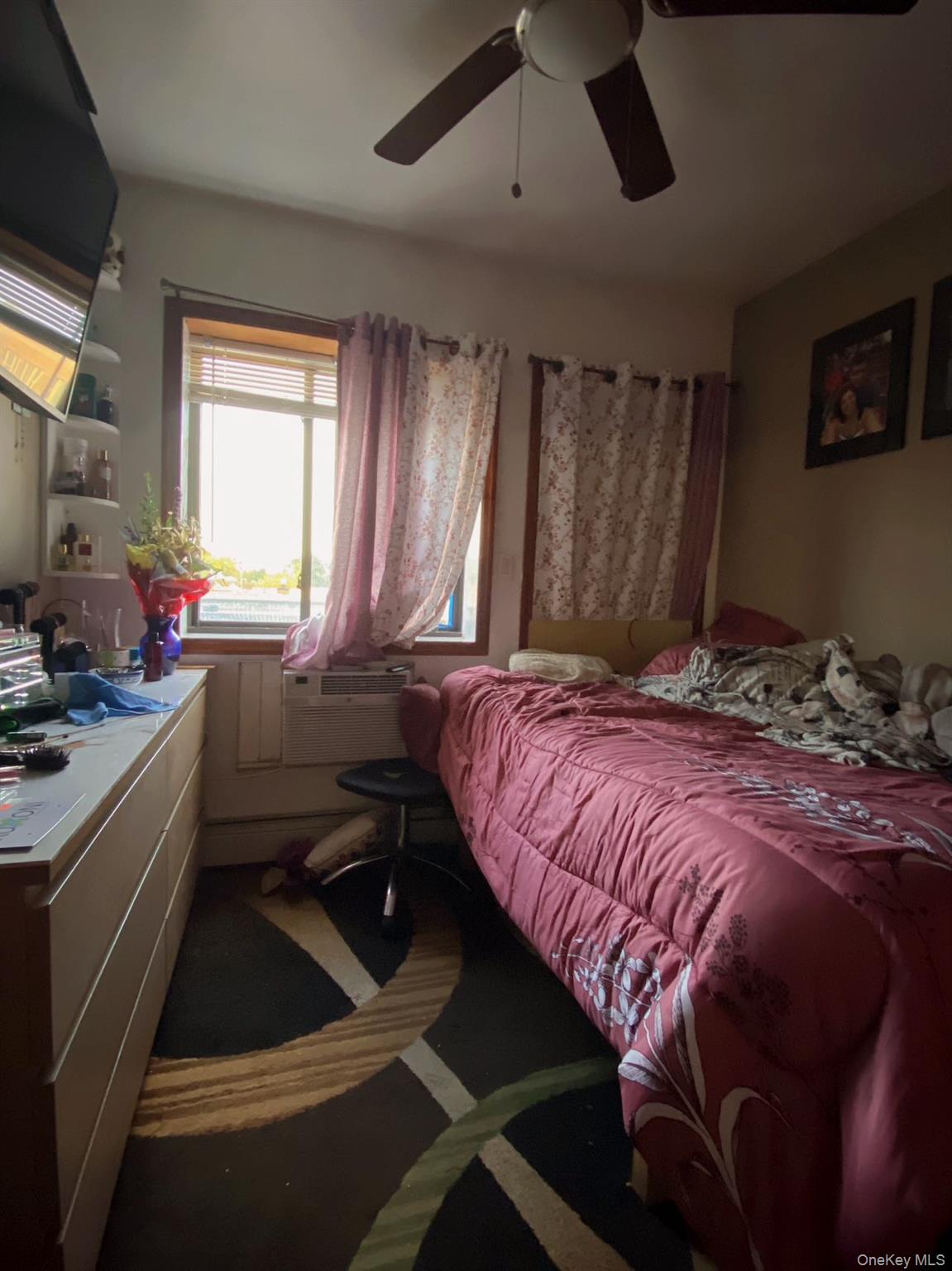 90-19 Corona Avenue Queens, NY 11373 - Photo 13 of 23 a bedroom with a bed and a large window