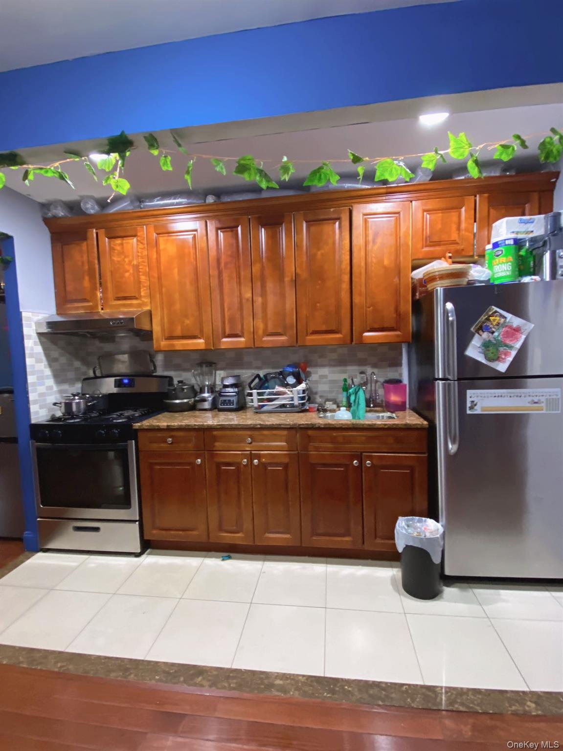 90-19 Corona Avenue Queens, NY 11373 - Photo 2 of 23 a kitchen with stainless steel appliances granite countertop a stove a sink and a microwave