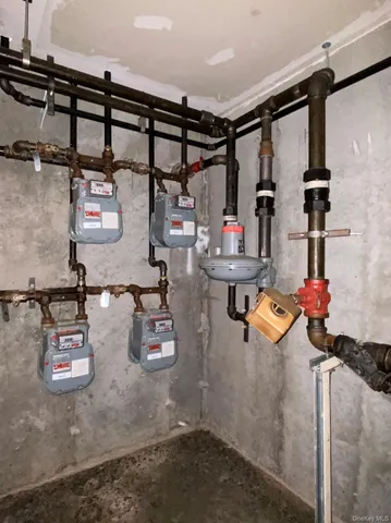 a view of a storage and utility room with washer and dryer