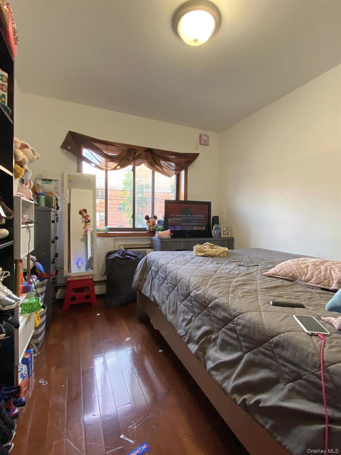90-19 Corona Avenue Queens, NY 11373 - Photo 5 of 23 a bedroom with a bed and a large window