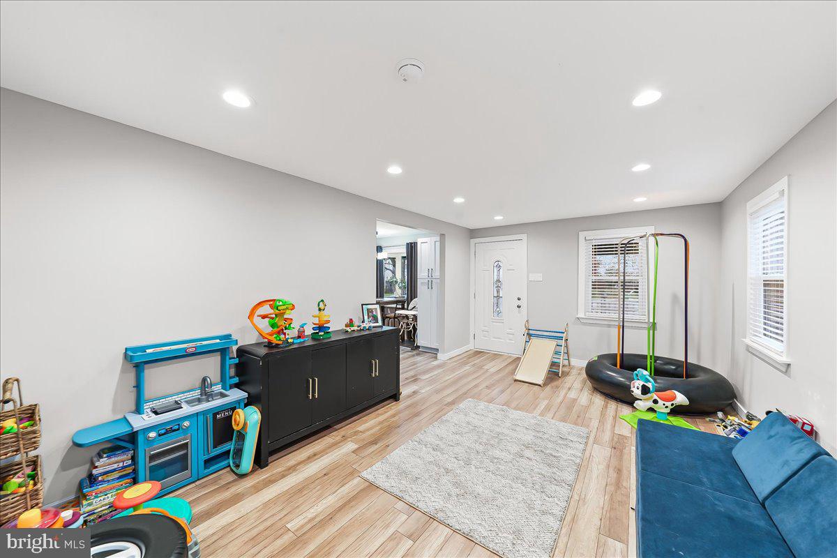 2330 Poe Road Secane, PA 19018 - Photo 12 of 33 a living room with furniture and a wooden floor