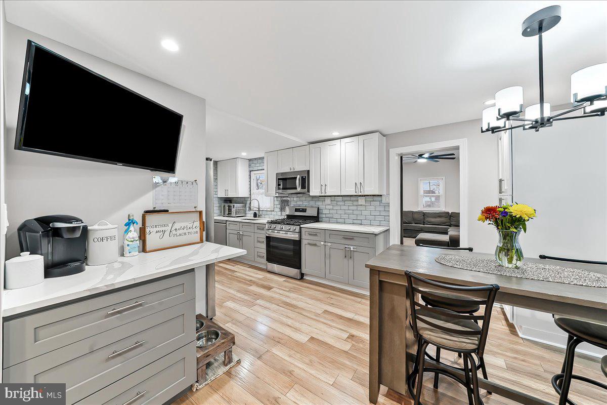 2330 Poe Road Secane, PA 19018 - Photo 14 of 33 a kitchen with a sink microwave and refrigerator