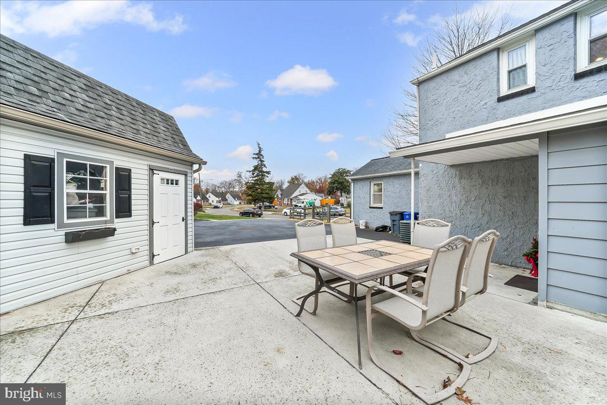 2330 Poe Road Secane, PA 19018 - Photo 28 of 33 a patio with a table and chairs and potted plants