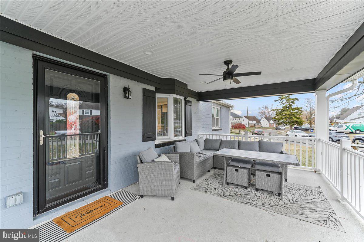 2330 Poe Road Secane, PA 19018 - Photo 4 of 33 a living room with furniture and a floor to ceiling window