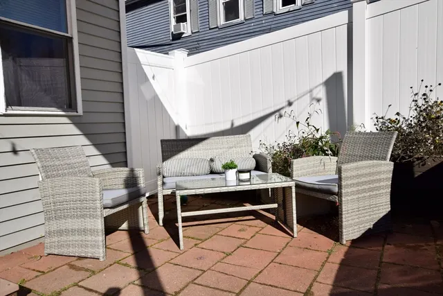 a view of house with outdoor seating and stairs