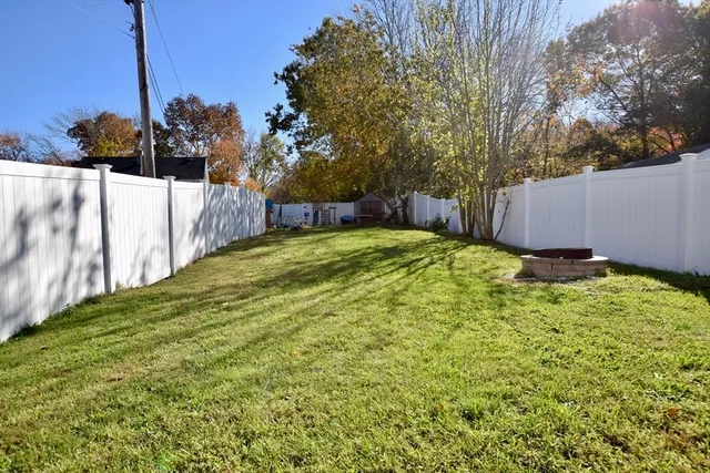 a view of a backyard of the house