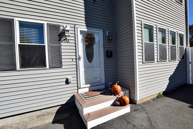 a view of a house with a bench and a window