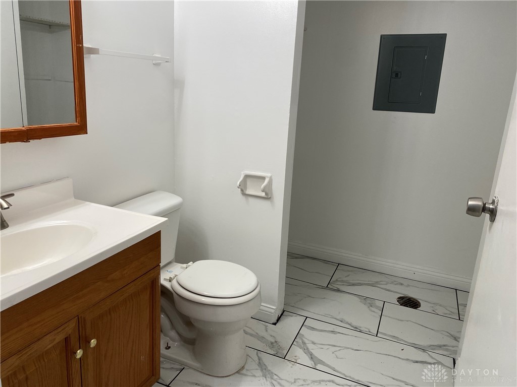 5551 Hummock Road Dayton, OH 45426 - Photo 5 of 11 half bath / laundry area