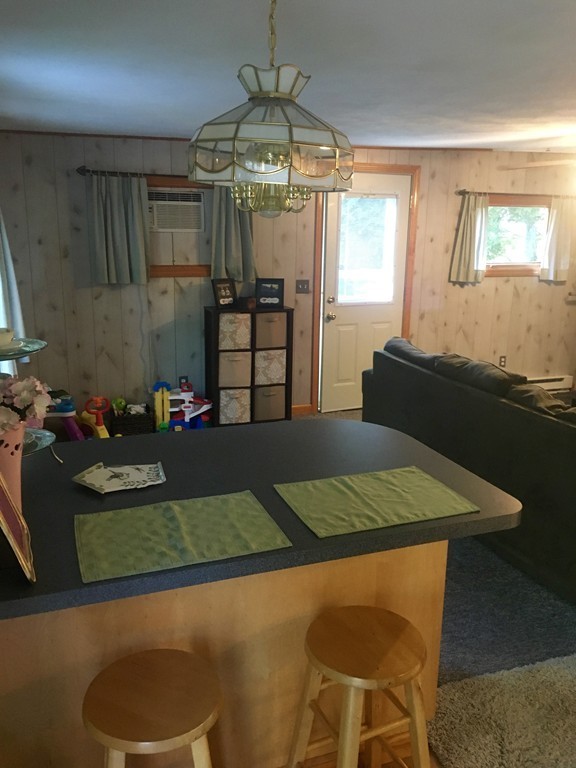 137 Vincent Street Springfield, MA 01129 - Photo 14 of 24 a view of a dining room with furniture and a chandelier