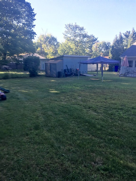 137 Vincent Street Springfield, MA 01129 - Photo 21 of 24 a view of house with yard and seating area