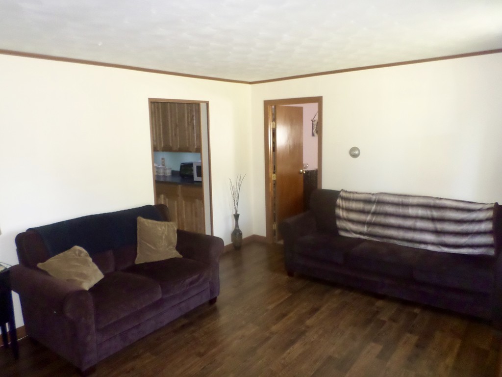 137 Vincent Street Springfield, MA 01129 - Photo 3 of 24 a living room with furniture and a wooden floor