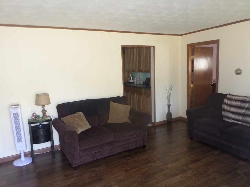 137 Vincent Street Springfield, MA 01129 - Photo 4 of 24 a living room with furniture and a wooden floor