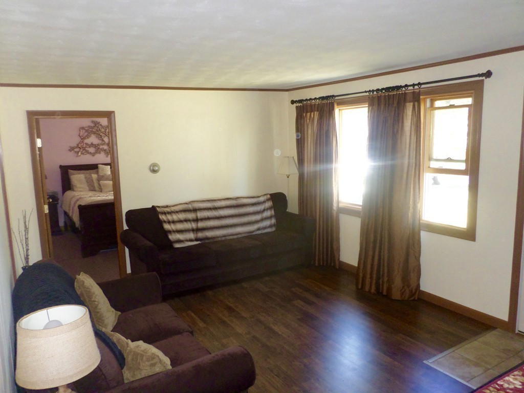 137 Vincent Street Springfield, MA 01129 - Photo 6 of 24 a room with furniture and a window