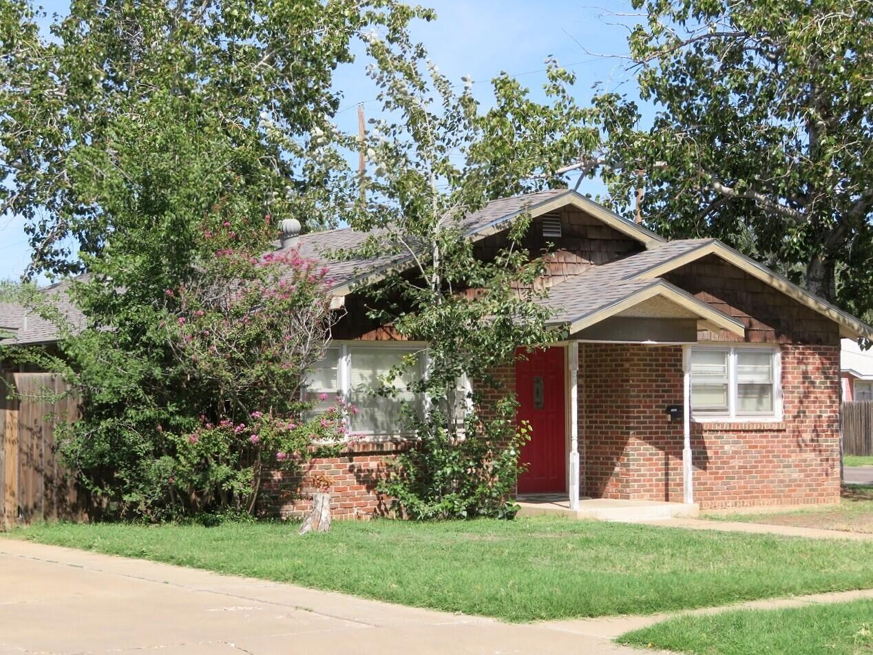 2702 22nd Street Lubbock, TX 79410 - Photo 1 of 9 a front view of a house with a yard