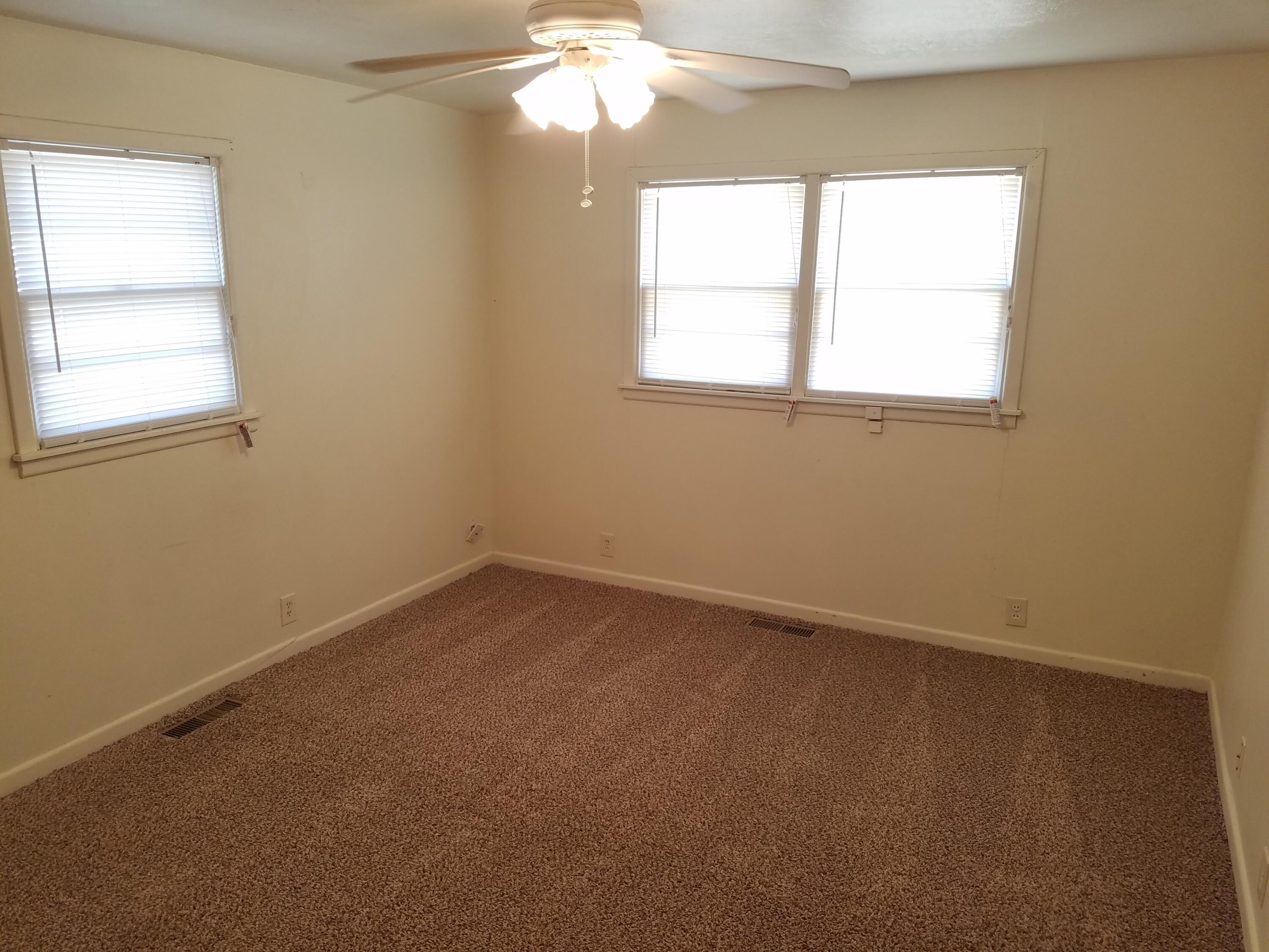 2702 22nd Street Lubbock, TX 79410 - Photo 4 of 9 an empty room with a window
