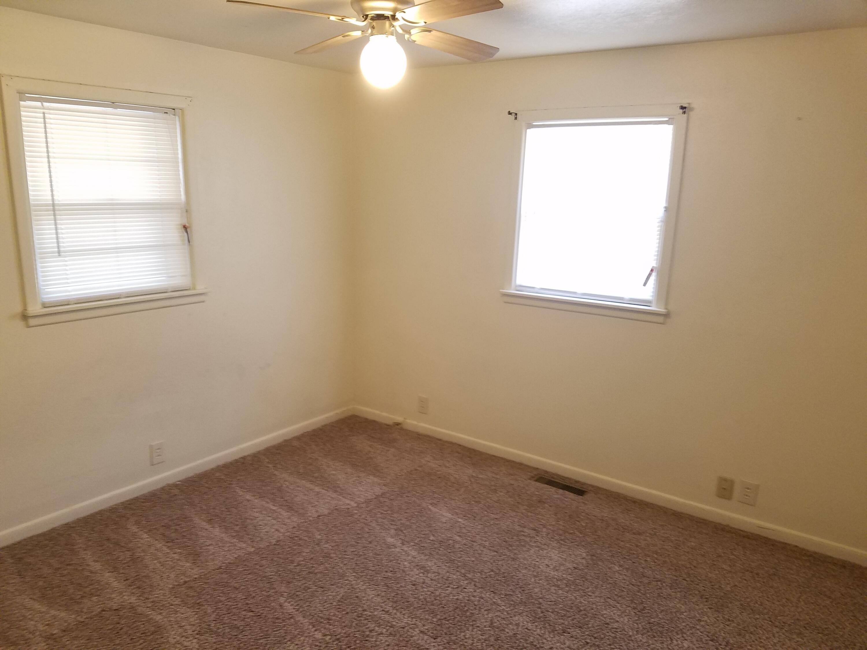 2702 22nd Street Lubbock, TX 79410 - Photo 7 of 9 an empty room with a window