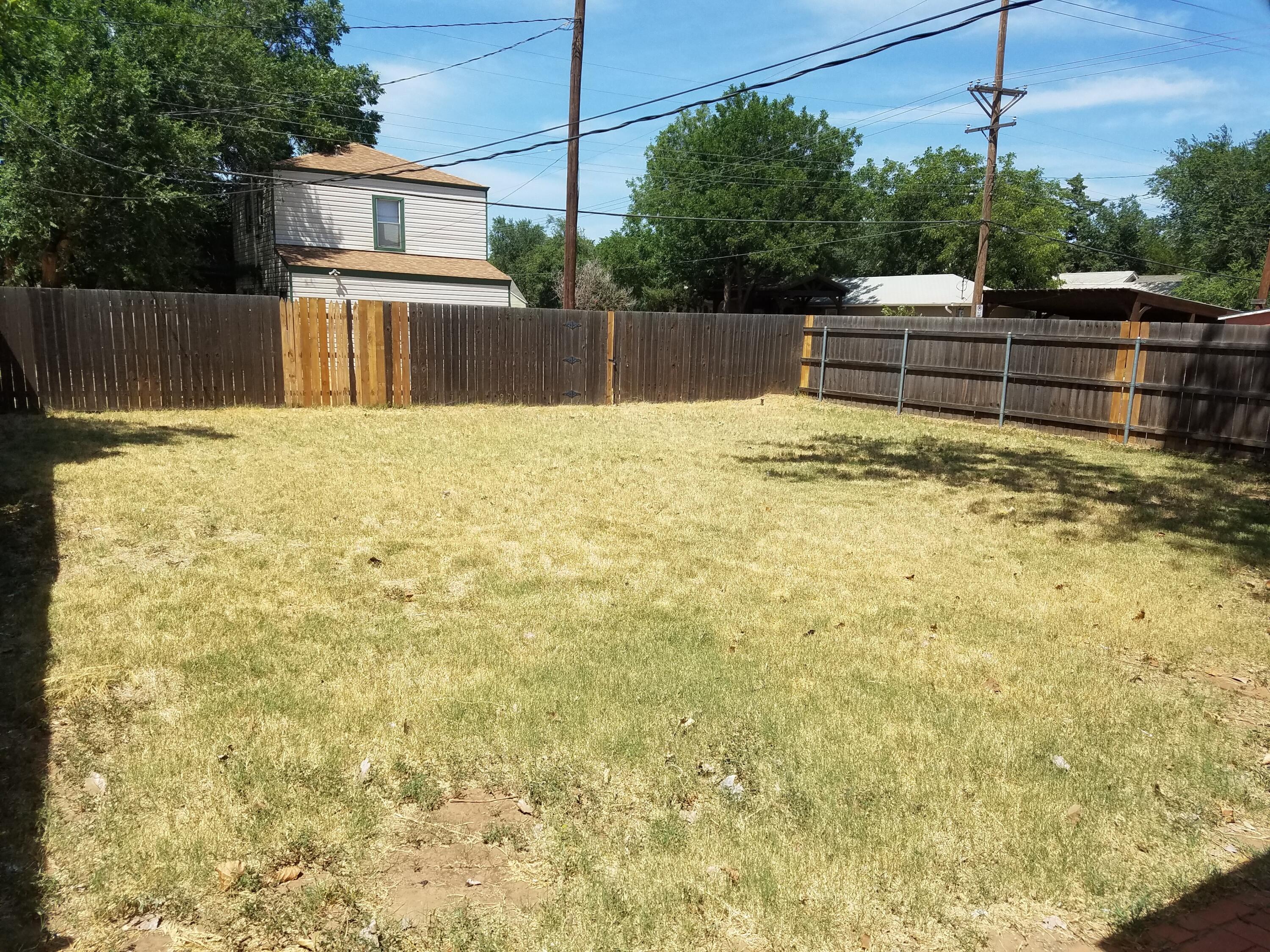 2702 22nd Street Lubbock, TX 79410 - Photo 9 of 9 a view of a backyard with a large pool
