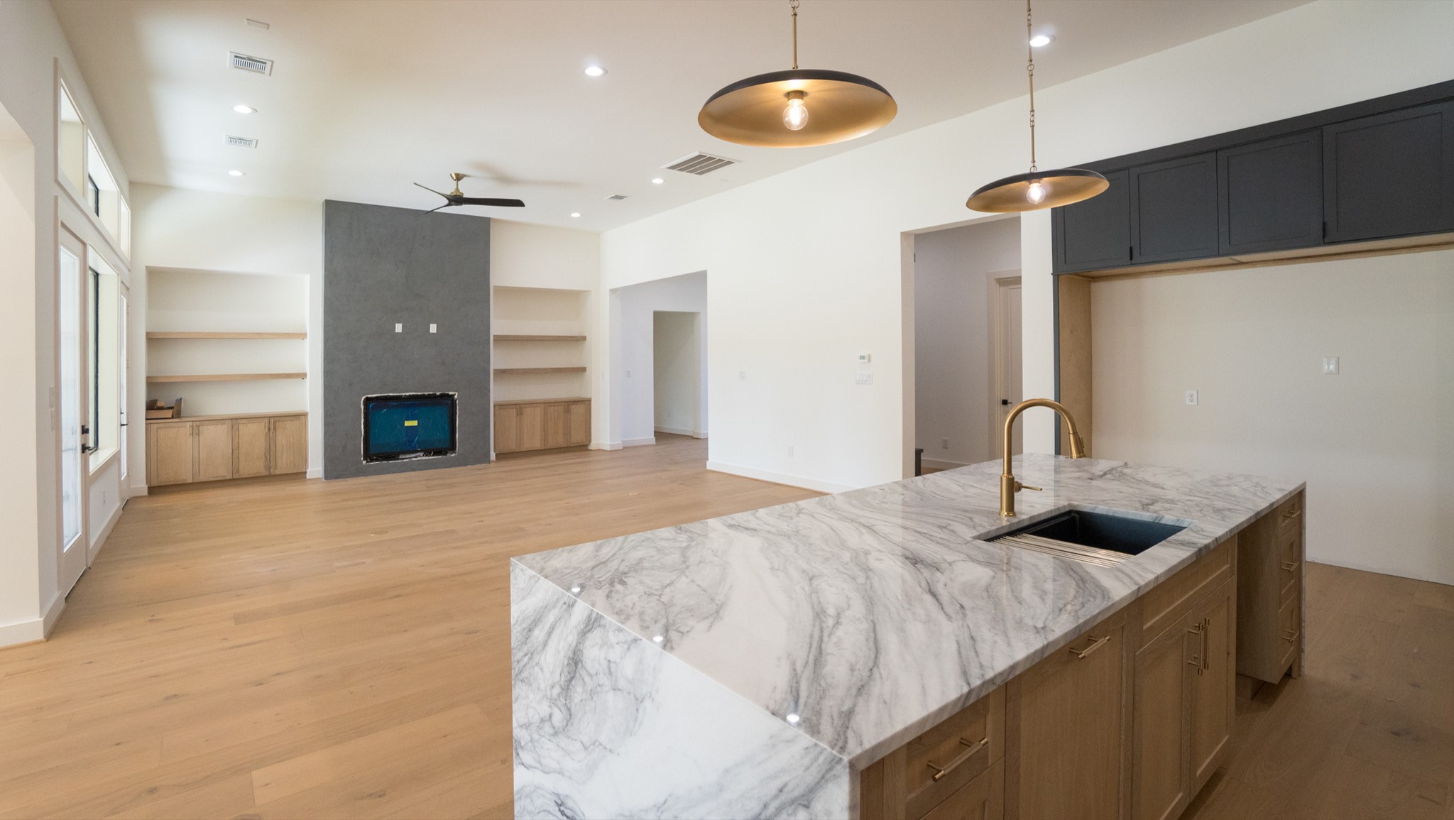 9345 Leto Road Houston, TX 77080 - Photo 6 of 27 a spacious bathroom with a granite countertop sink and a mirror