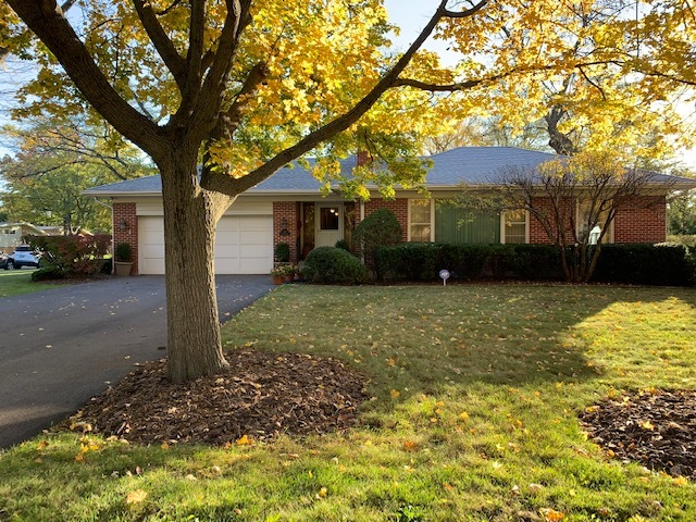 1531 Sunset Ridge Road Northbrook, IL 60062 - Photo 1 of 1 a front view of a house with a yard