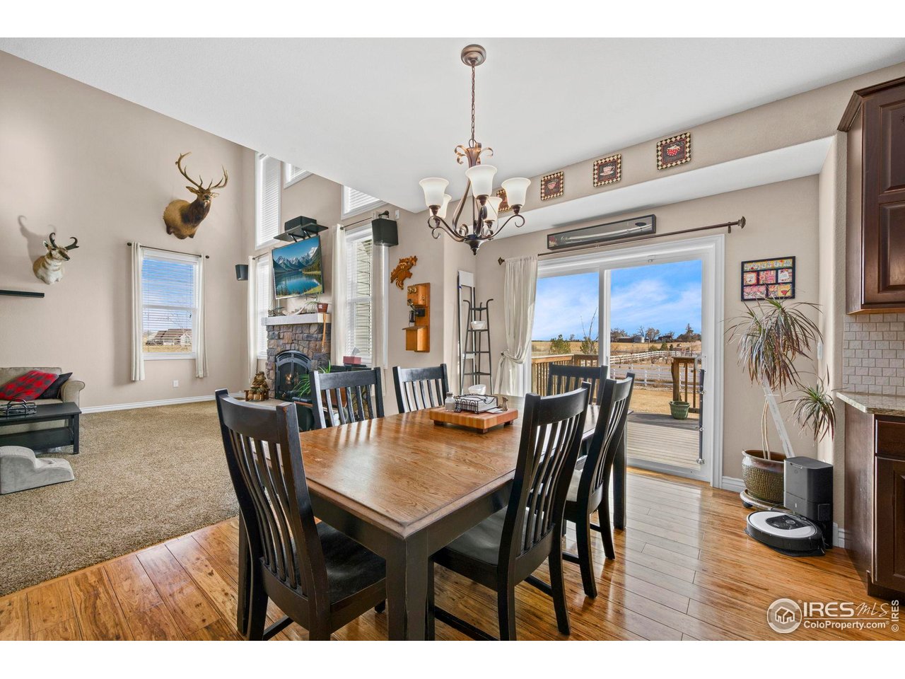 1302 Park Ridge Drive Severance, CO 80615 - Photo 11 of 35 a view of a dining room with furniture and wooden floor