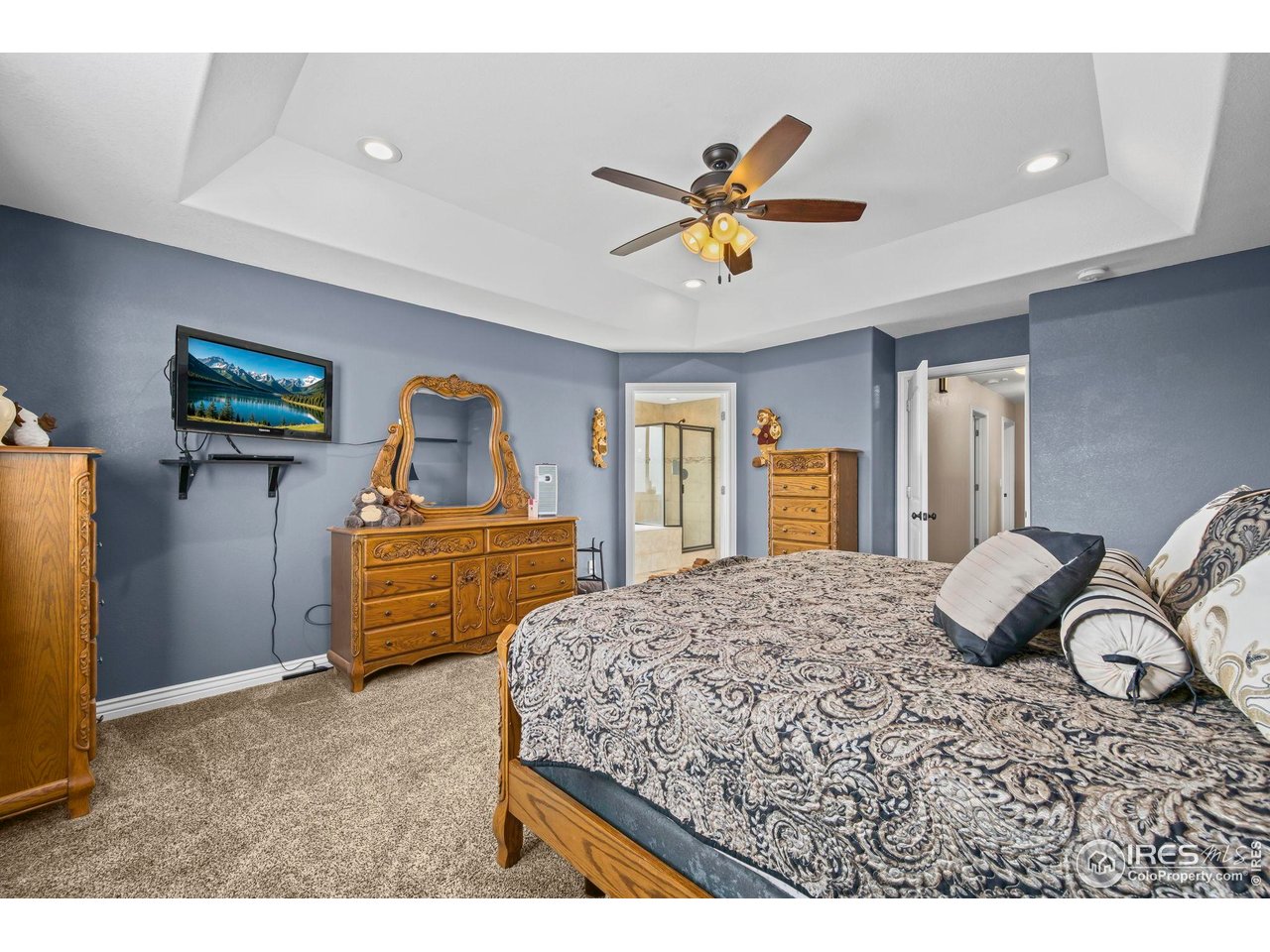 1302 Park Ridge Drive Severance, CO 80615 - Photo 21 of 35 a bedroom with a bed and dresser