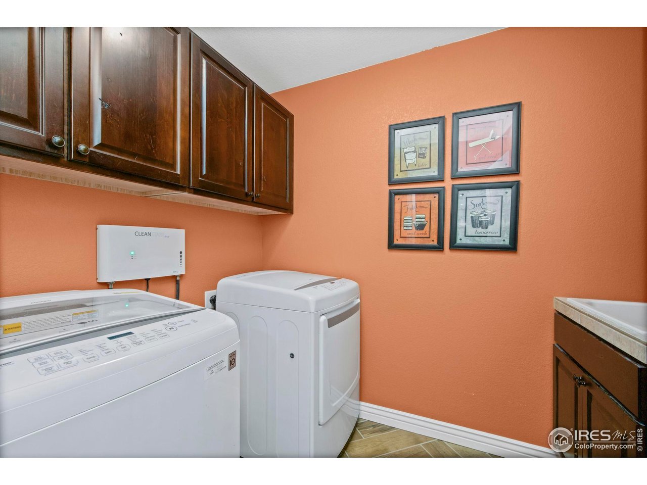 1302 Park Ridge Drive Severance, CO 80615 - Photo 23 of 35 a utility room with dryer and washer
