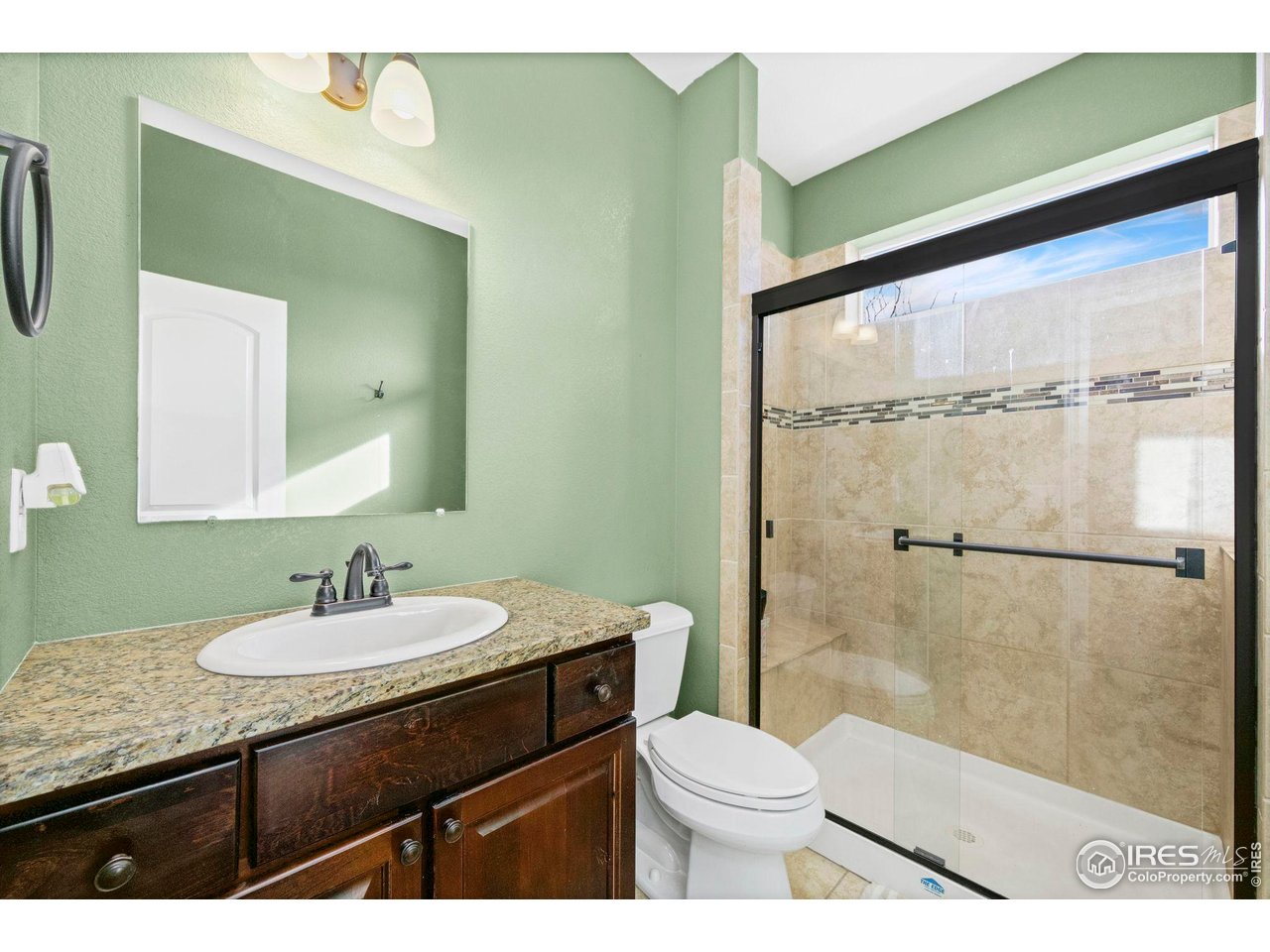 1302 Park Ridge Drive Severance, CO 80615 - Photo 8 of 35 a bathroom with a sink a toilet and shower