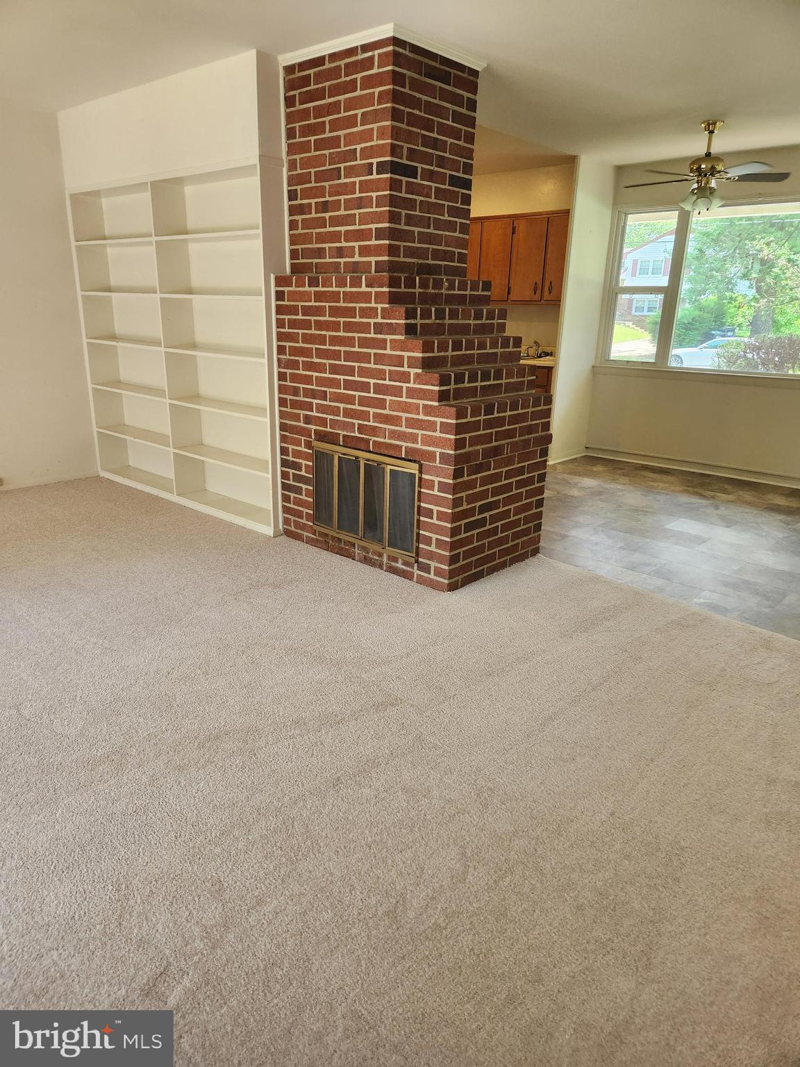 7510 Hogarth Street Springfield, VA 22151 - Photo 29 of 47 Double-sided fireplace. built-in shelves