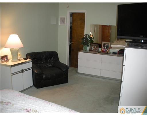 43 Cambridge Road Edison, NJ 08817 - Photo 12 of 21 a living room with furniture and a flat screen tv