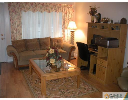 43 Cambridge Road Edison, NJ 08817 - Photo 13 of 21 a living room with furniture and a fireplace