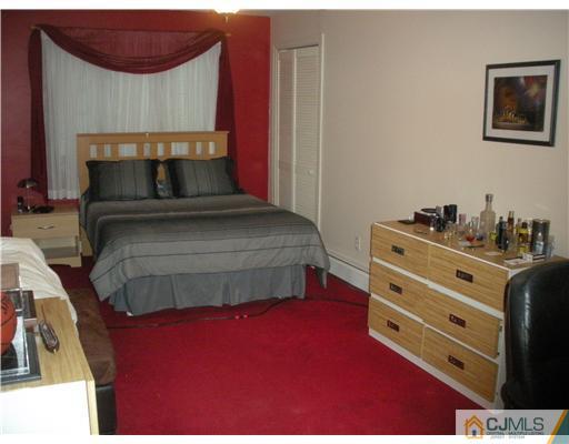 43 Cambridge Road Edison, NJ 08817 - Photo 14 of 21 a bedroom with a bed and a dresser