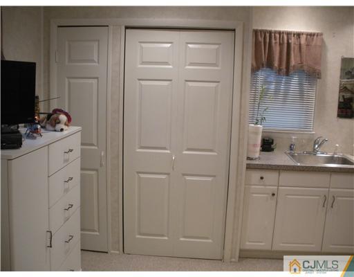 43 Cambridge Road Edison, NJ 08817 - Photo 16 of 21 a bathroom with a sink and mirror