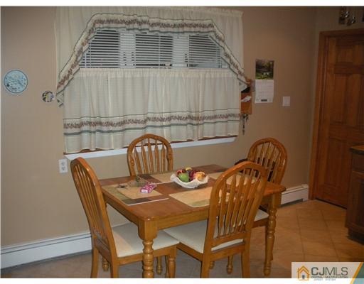43 Cambridge Road Edison, NJ 08817 - Photo 5 of 21 a view of a dining room with furniture and wooden floor