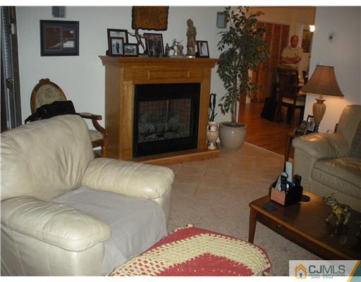 43 Cambridge Road Edison, NJ 08817 - Photo 7 of 21 a living room with furniture and a fireplace