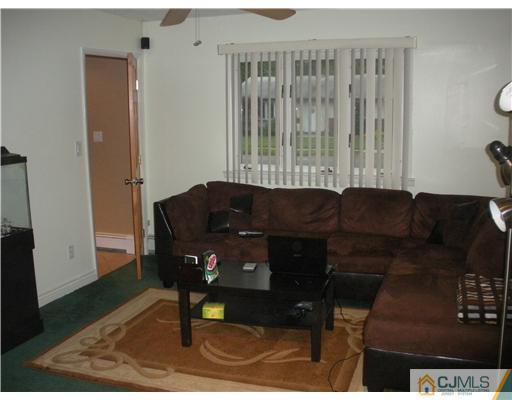 43 Cambridge Road Edison, NJ 08817 - Photo 9 of 21 a living room with furniture and a window