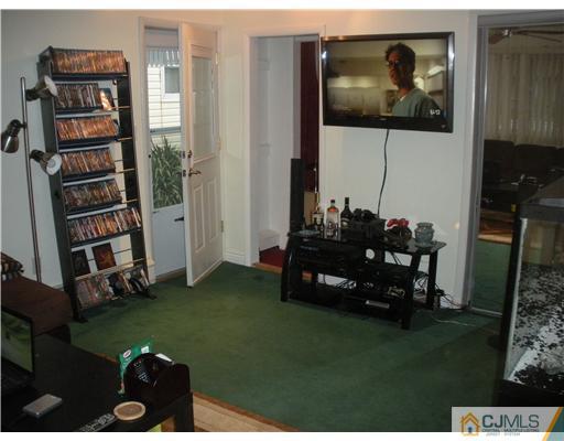 43 Cambridge Road Edison, NJ 08817 - Photo 10 of 21 a living room with furniture and a floor to ceiling window