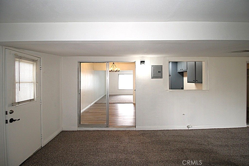 700 Arbor Way Barstow, CA 92311 - Photo 14 of 37 a view of a hallway with wooden floor and staircase