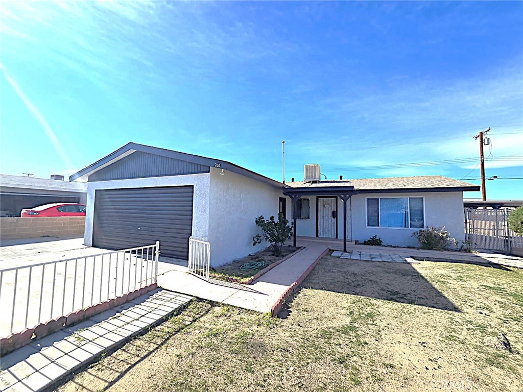700 Arbor Way Barstow, CA 92311 - Photo 2 of 37 a view of a house with wooden fence